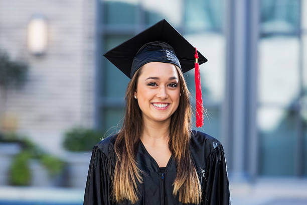 Headshot of Nashley Vazquez, wearing a cap and gown